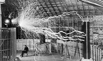 Image: Dickenson V. Alley, “Nikola Tesla, with His Equipment”, restored by Lošmi is licensed under CC BY 4.0, December 1899.
